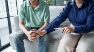 Man talking with therapist about Who Pays for Sober Living Homes?